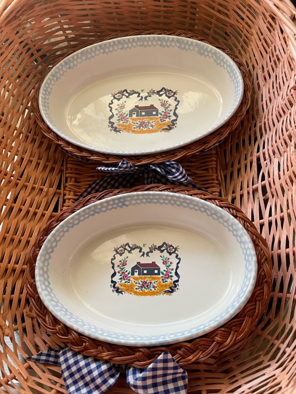 Oval Ceramic Serving Dish with Light Blue Rim and Country Motif. Wicker Baskets.